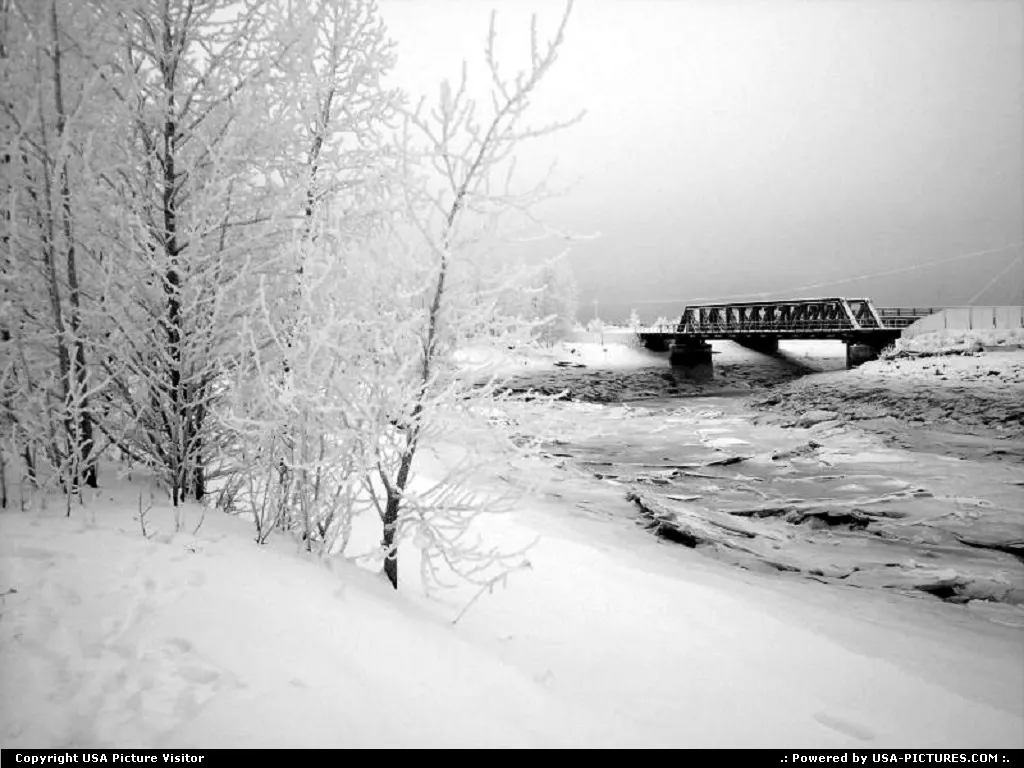 Cold and desolate rail bridge over Ship Creek in Anchorage Alaska.
