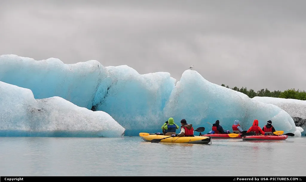 Iceberg, calved from Valdez Glacier (Alaska) thrills kayakkers in Lake Valdez.