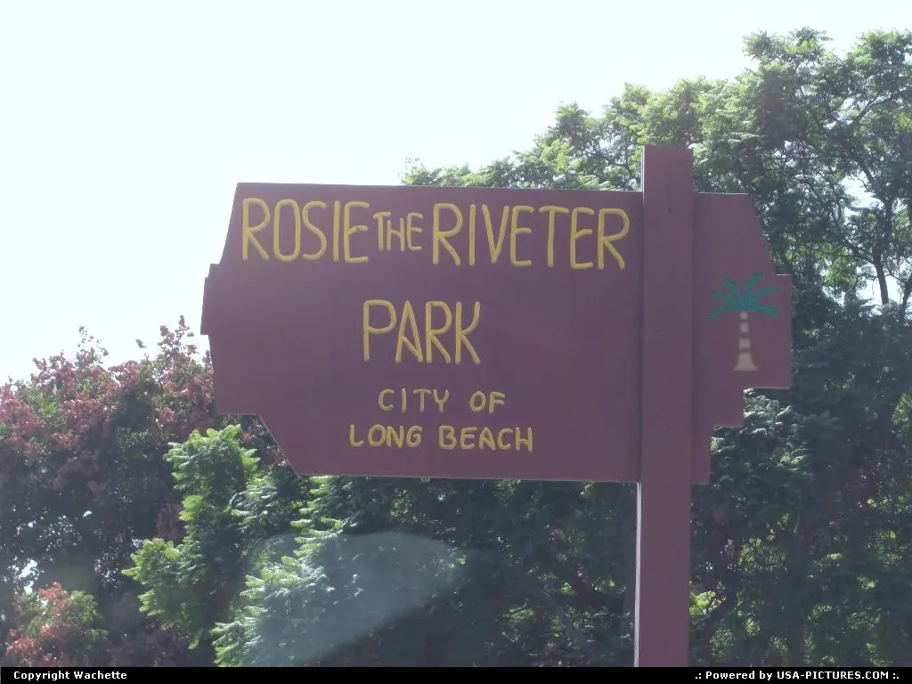 Park sign in Long Beach of which name is Rosie the riveter.Rosie the riveter is the sym...