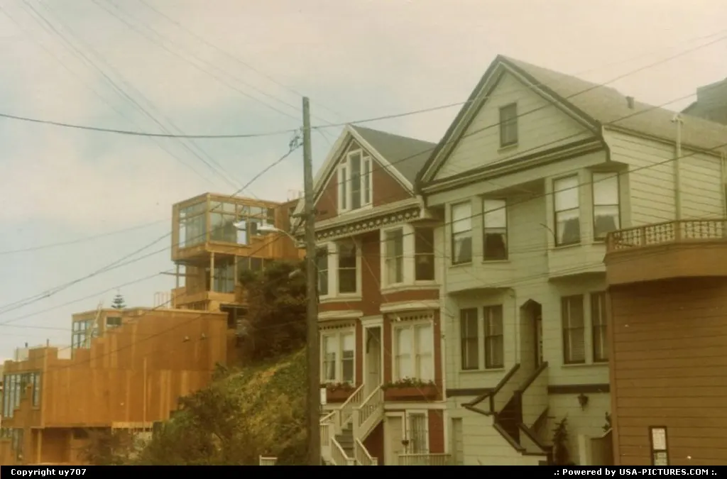 Houses from all ages along with some intricate electric wires around.