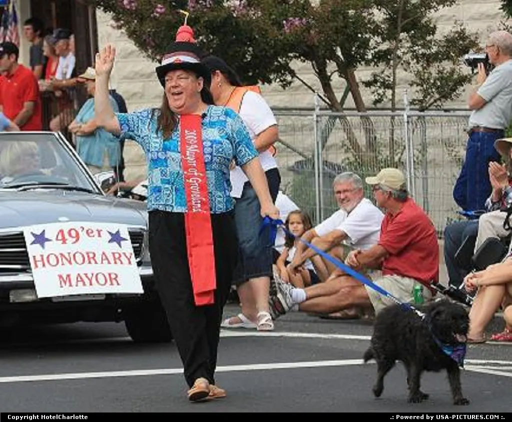Mayor Goose (the dog) leads annual 49er Festival Town Parade with Lynn Upthagrove, owne...