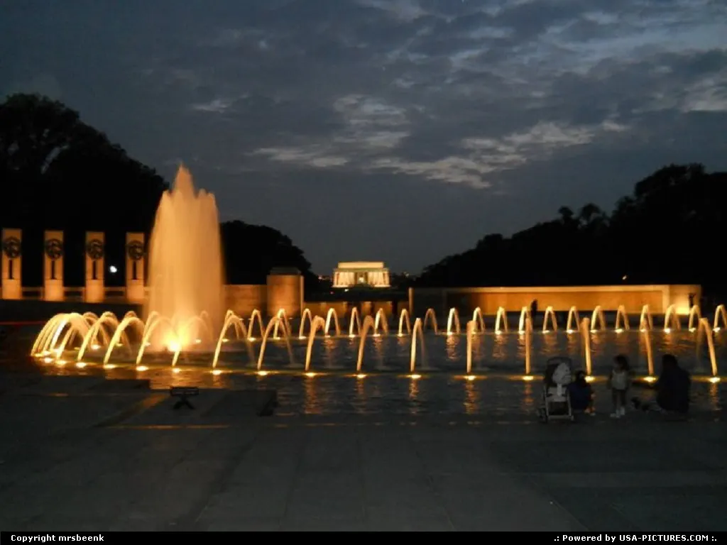 Looking past WWII Memorial to Lincoln Memorial at sunset