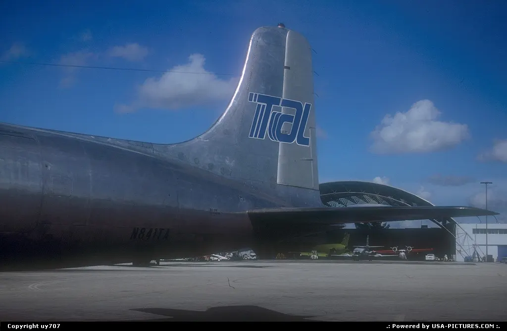 Close-up of a then residing TAL/Trans-Air-Links Douglas DC.6BF resting at base somewher...