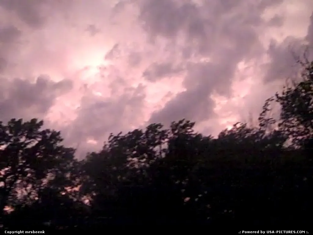 Sun behind eerie storm clouds