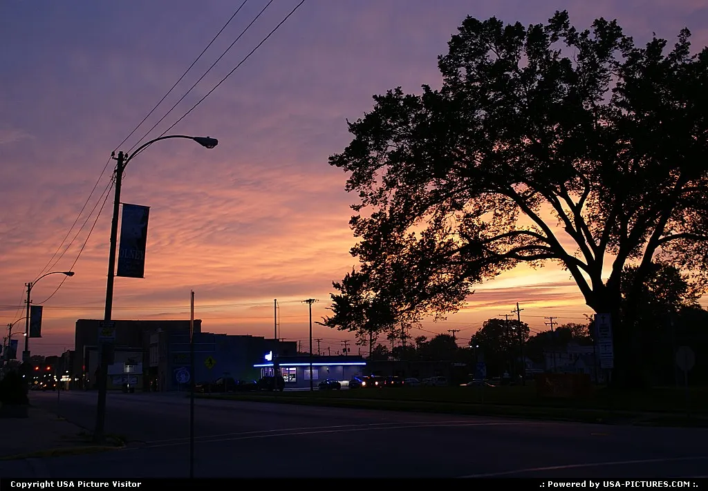 Beautiful summer sunset down the main street of a rural community.