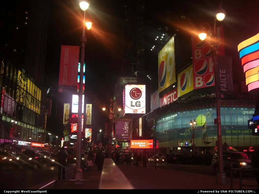Another view of Times Square by night. Plenty of neons and billboards around.