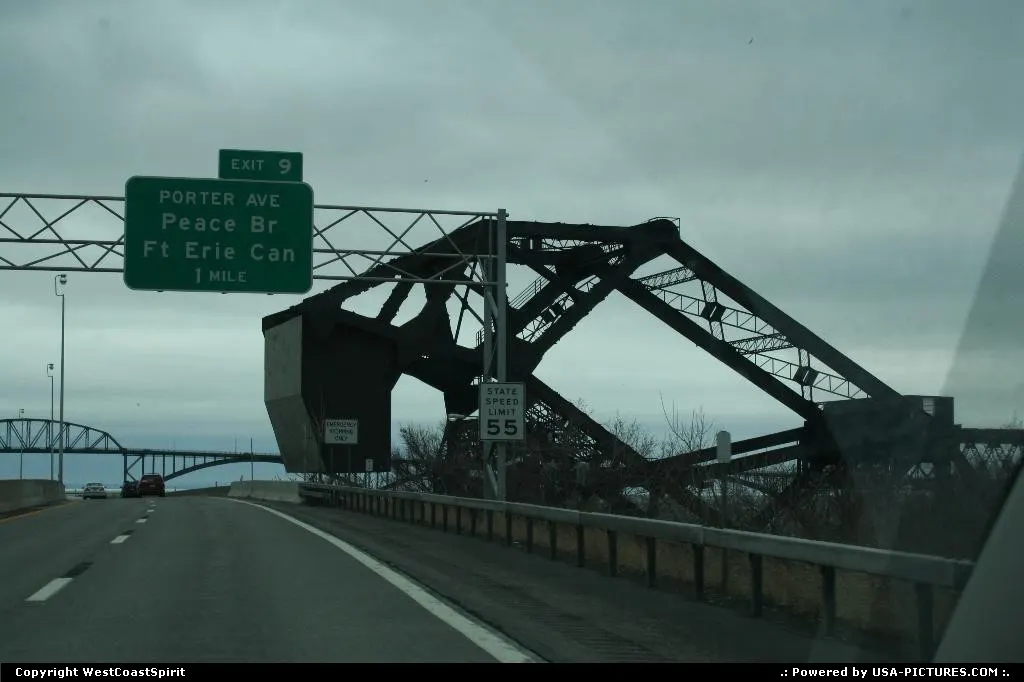 A massive, rusted bridge from the road