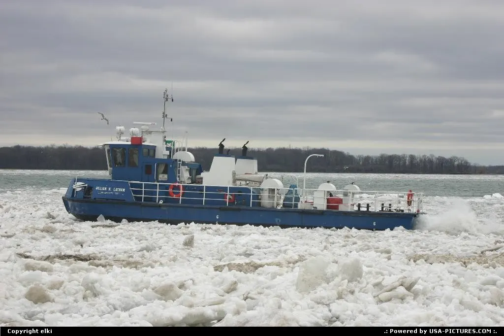 Niagara river, a boat is operating. Maybe to break the ice ?