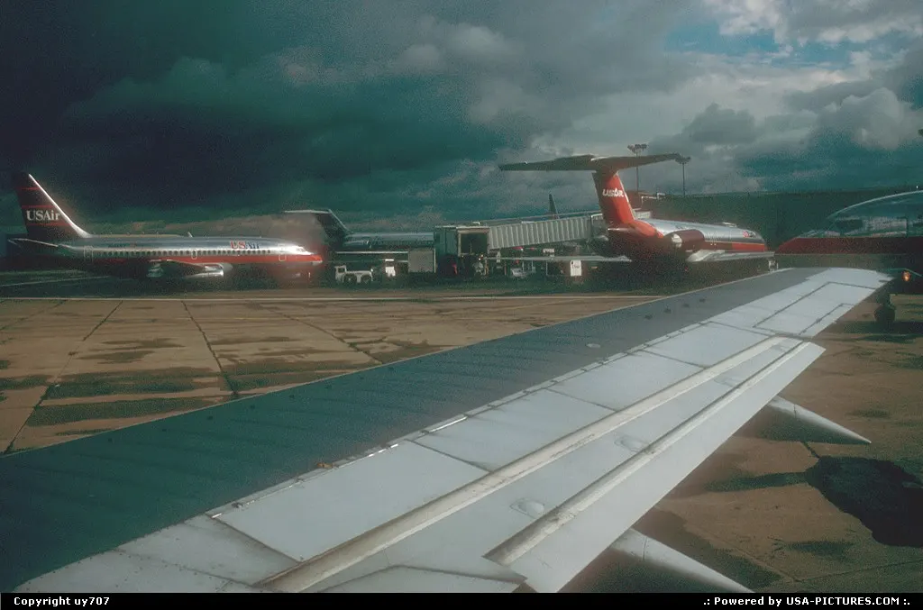 Departing the gate area rented by US Air when the latter locally ruled supreme ...
