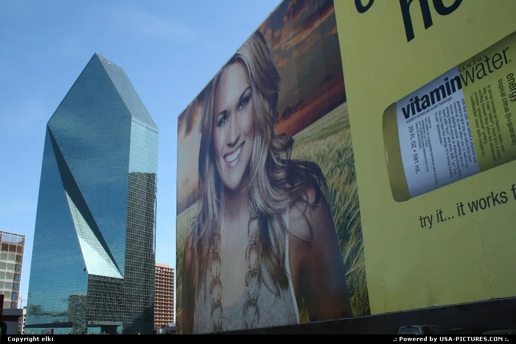 wells fargo tower, behind an advertising