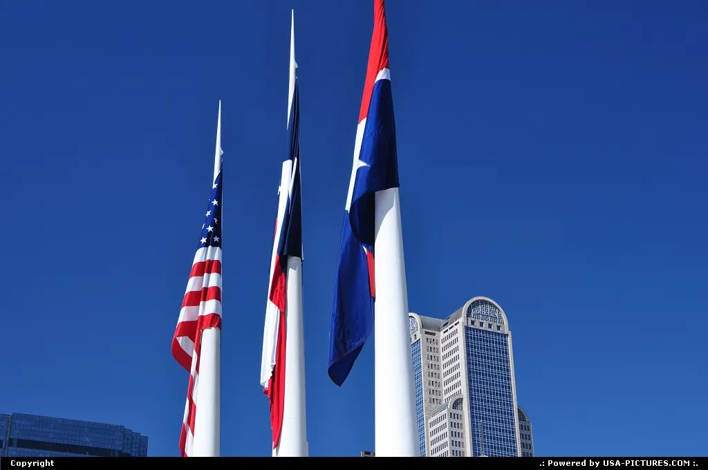 The deep blue Texan sky offers for sure a great background for the 3 flags in front of...